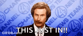 A Man With A Mustache Is Standing In Front Of A News Team And Says This Just In GIF
