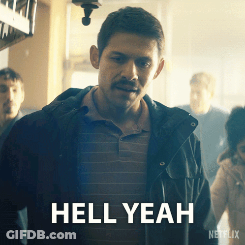A Man With A Mustache Is Standing In Front Of A Sign That Says " Hell Yeah " GIF