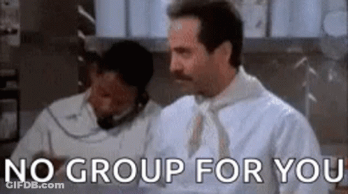 A Man With A Mustache Is Standing In Front Of A Sign That Says No Group For You . GIF