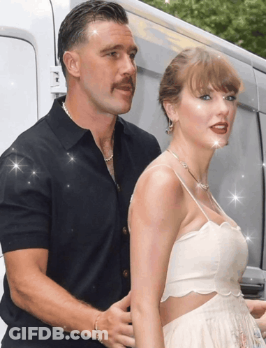A Man With A Mustache Is Standing Next To A Woman With Red Lipstick GIF