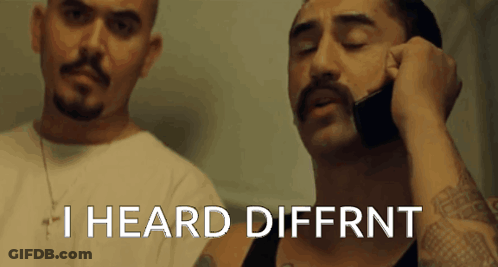 A Man With A Mustache Is Talking On A Cell Phone With The Words I Heard Diffrnt Above Him GIF