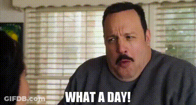A Man With A Mustache Is Talking To A Woman In Front Of A Window . GIF