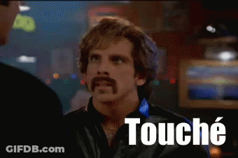 A Man With A Mustache Is Talking To Another Man And The Word Touche Is On The Screen Behind Him GIF