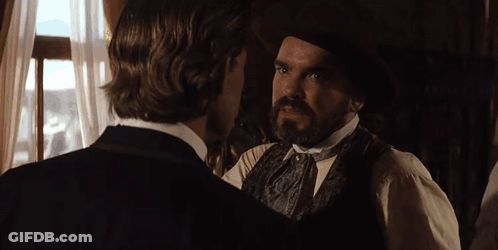 A Man With A Mustache Is Talking To Another Man With The Words Go Ahead Above Him GIF