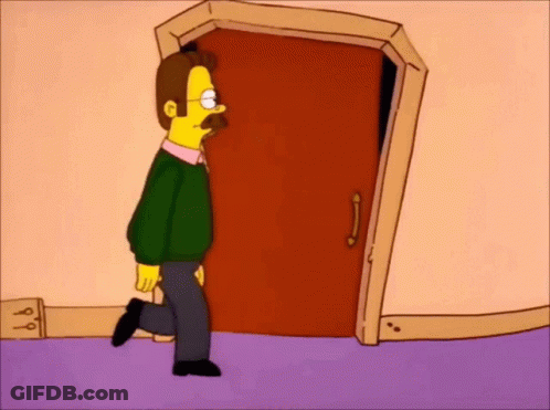 A Man With A Mustache Is Walking Through A Door . GIF