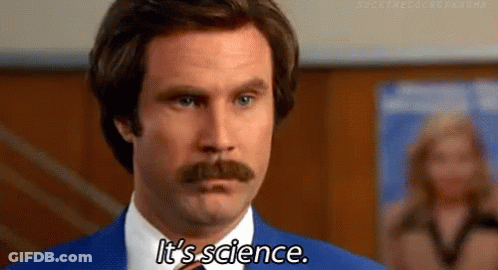 A Man With A Mustache Is Wearing A Blue Suit And Tie And Saying It 'S Science . GIF