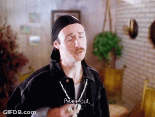 A Man With A Mustache Is Wearing A Hat And A Necklace And Says Peace Out GIF
