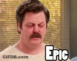 A Man With A Mustache Is Wearing A Hospital Gown And The Word Epic Is On His Chest . GIF