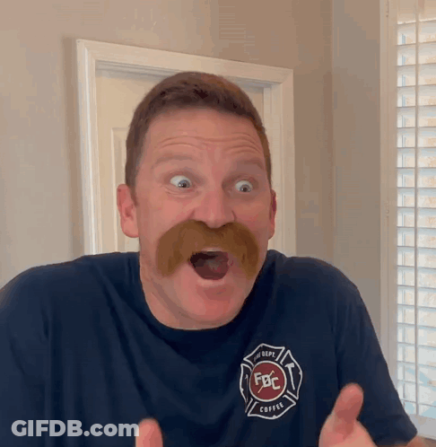 A Man With A Mustache Is Wearing A Shirt That Says Fbc GIF