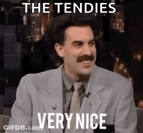 A Man With A Mustache Is Wearing A Suit And Tie And Says The Tendies Very Nice . GIF