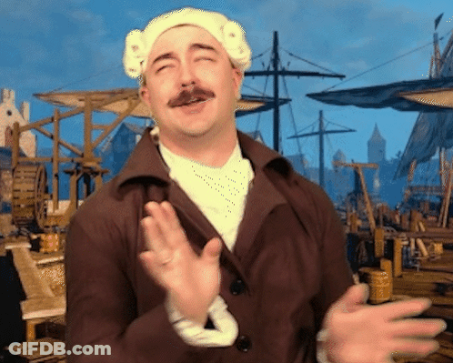 A Man With A Mustache Is Wearing A White Hat And A Brown Coat GIF