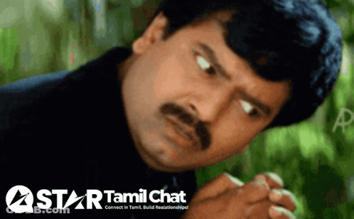 A Man With A Mustache Looks At The Camera With A Star Tamil Chat Logo Behind Him GIF