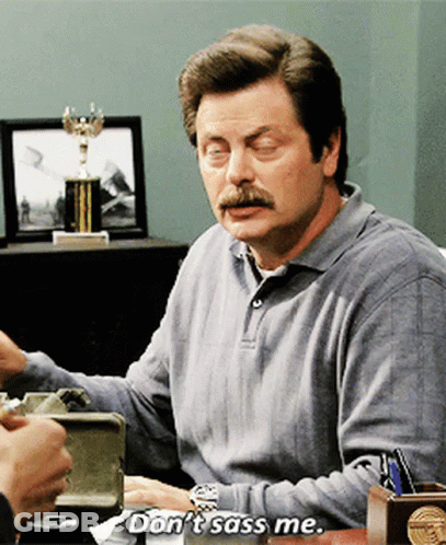 A Man With A Mustache Says " Don 'T Sass Me " While Sitting At A Desk GIF