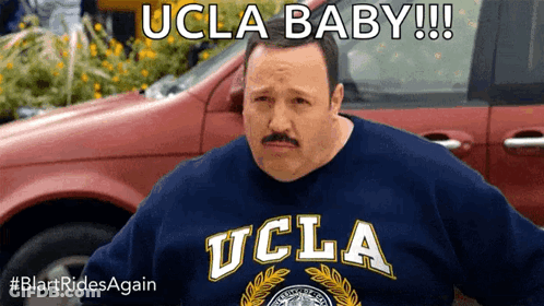 A Man With A Mustache Wearing A Blue Ucla Sweatshirt GIF