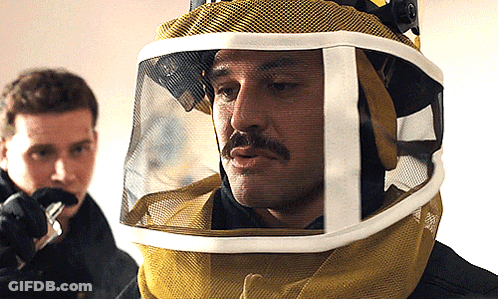 A Man With A Mustache Wearing A Helmet With A Visor GIF