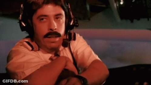 A Man With A Mustache Wearing Headphones And A Microphone GIF