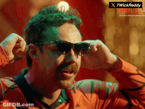 A Man With A Mustache Wearing Sunglasses With A Netflix Logo In The Corner GIF