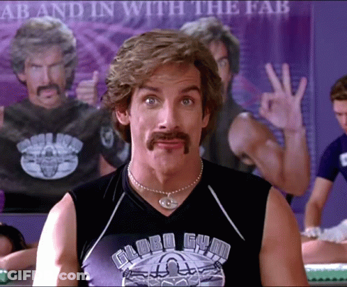 A Man With A Mustache Wears A Globe Gym Shirt GIF