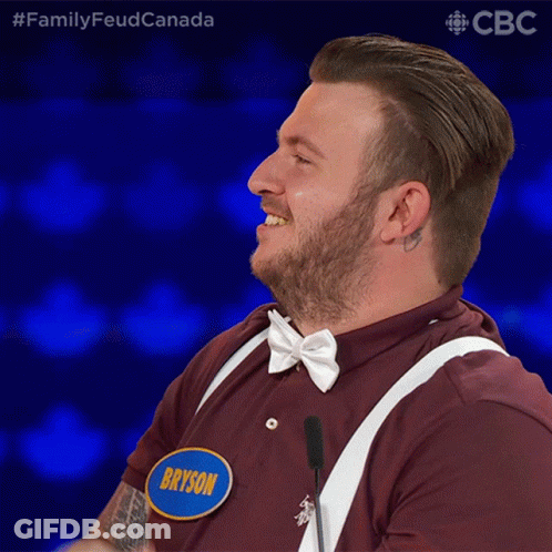 A Man With A Name Tag That Says Bryson Is Laughing GIF