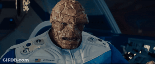 A Man With A Name Tag That Says Grimm Looks At The Camera GIF