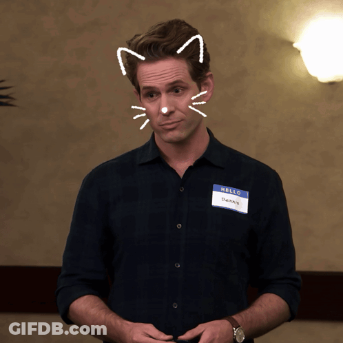A Man With A Name Tag That Says Hello On It GIF
