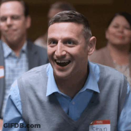 A Man With A Name Tag That Says Stan GIF