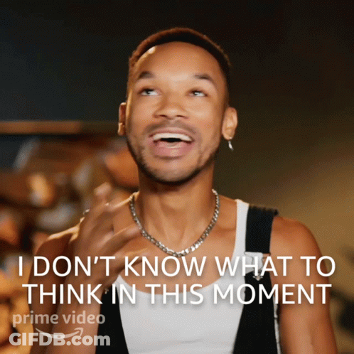 A Man With A Necklace Is Laughing With The Words " I Don 'T Know What To Think In This Moment " Above Him GIF