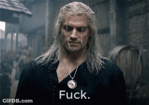 A Man With A Necklace That Has The Word Fuck On It GIF