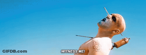 A Man With A Needle Sticking Out Of His Neck And The Words `` Witness Me '' . GIF