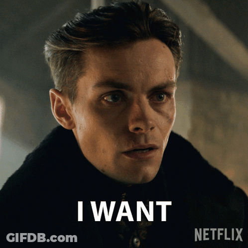 A Man With A Netflix Logo Behind Him GIF