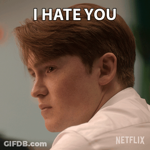 A Man With A Netflix Logo On His Shirt GIF