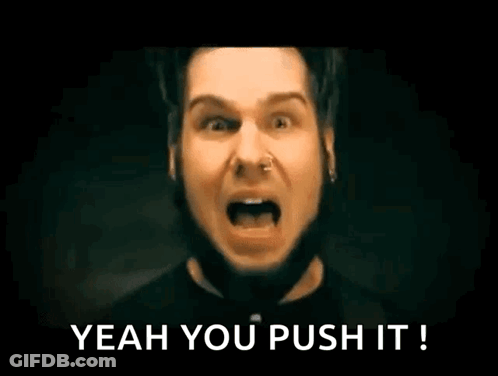 A Man With A Nose Ring Is Screaming With His Mouth Open And The Words `` Yeah You Push It '' Written Below Him . GIF