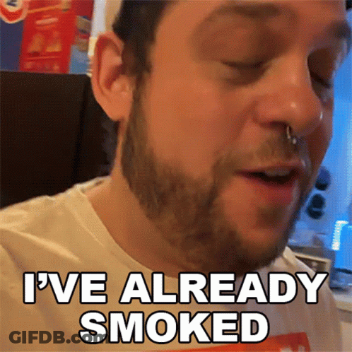 A Man With A Nose Ring Is Smoking A Cigarette And Says I 'Ve Already Smoked GIF