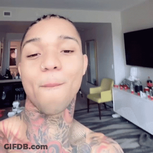 A Man With A Nose Ring Is Taking A Selfie GIF