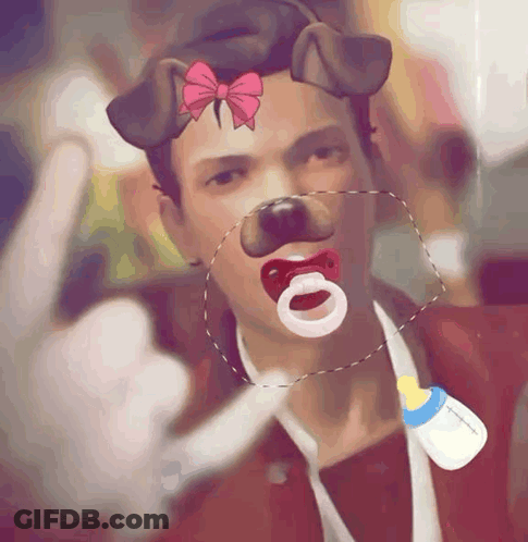 A Man With A Pacifier In His Mouth And A Bottle Around His Neck GIF