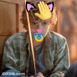A Man With A Pacifier In His Mouth Has A Cat Ear And A Hand On His Head GIF