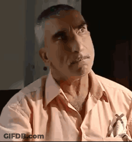 A Man With A Pen In His Pocket Is Looking Up GIF