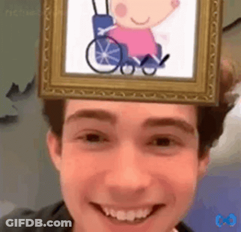 A Man With A Picture Of A Girl In A Wheelchair On His Head GIF