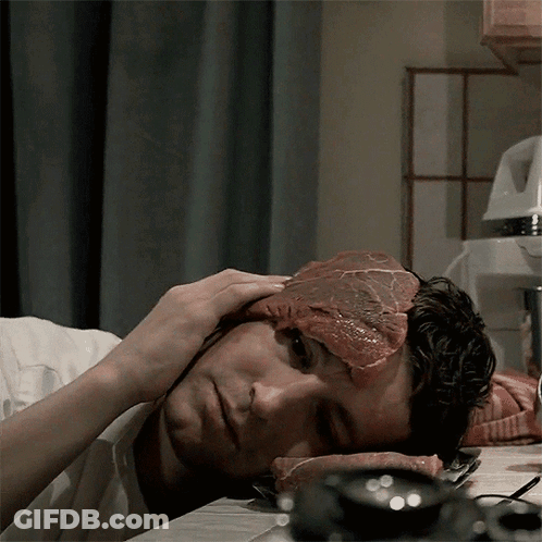 A Man With A Piece Of Meat On His Face GIF
