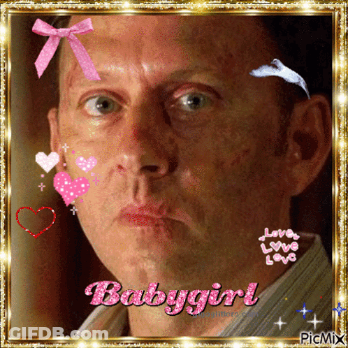 A Man With A Pink Bow On His Head And The Words Babygirl GIF