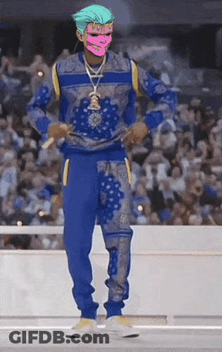 A Man With A Pink Mask On His Face Is Wearing A Blue Sweater And Blue Sweatpants GIF