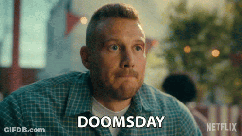 A Man With A Plaid Shirt Says Doomsday GIF
