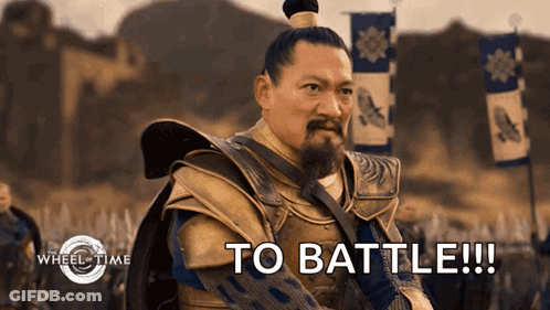 A Man With A Ponytail And A Beard Says To Battle GIF