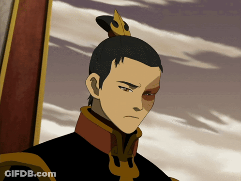 A Man With A Ponytail And A Crown On His Head Looks At The Camera GIF