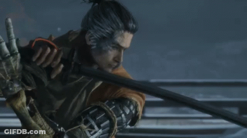 A Man With A Ponytail Is Holding A Sword In His Right Hand GIF