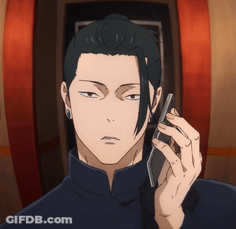 A Man With A Ponytail Is Talking On A Cellphone GIF