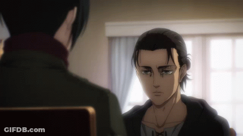 A Man With A Ponytail Looks At Another Man GIF