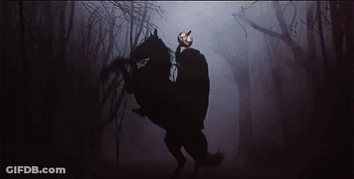 A Man With A Pumpkin Head Is Riding A Horse In The Dark GIF