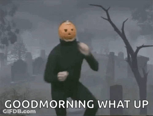 A Man With A Pumpkin On His Head Is Dancing In A Cemetery And Says Good Morning What Up GIF