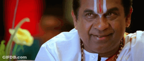 A Man With A Red And White Stripe On His Forehead Smiles For The Camera GIF